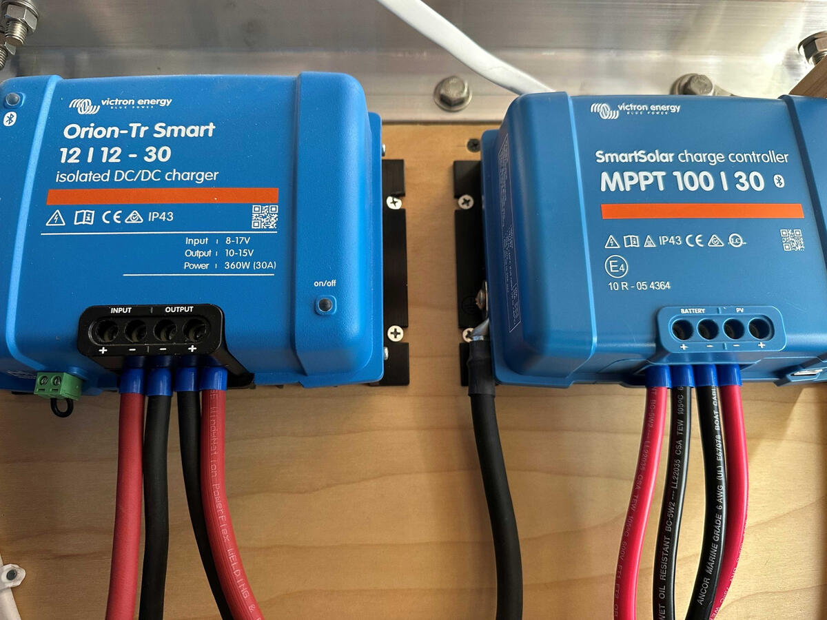 Victron Orion DC-DC charger and SmartSolar MPPT solar charge controller installed in a custom Ram ProMaster camper van electrical system.